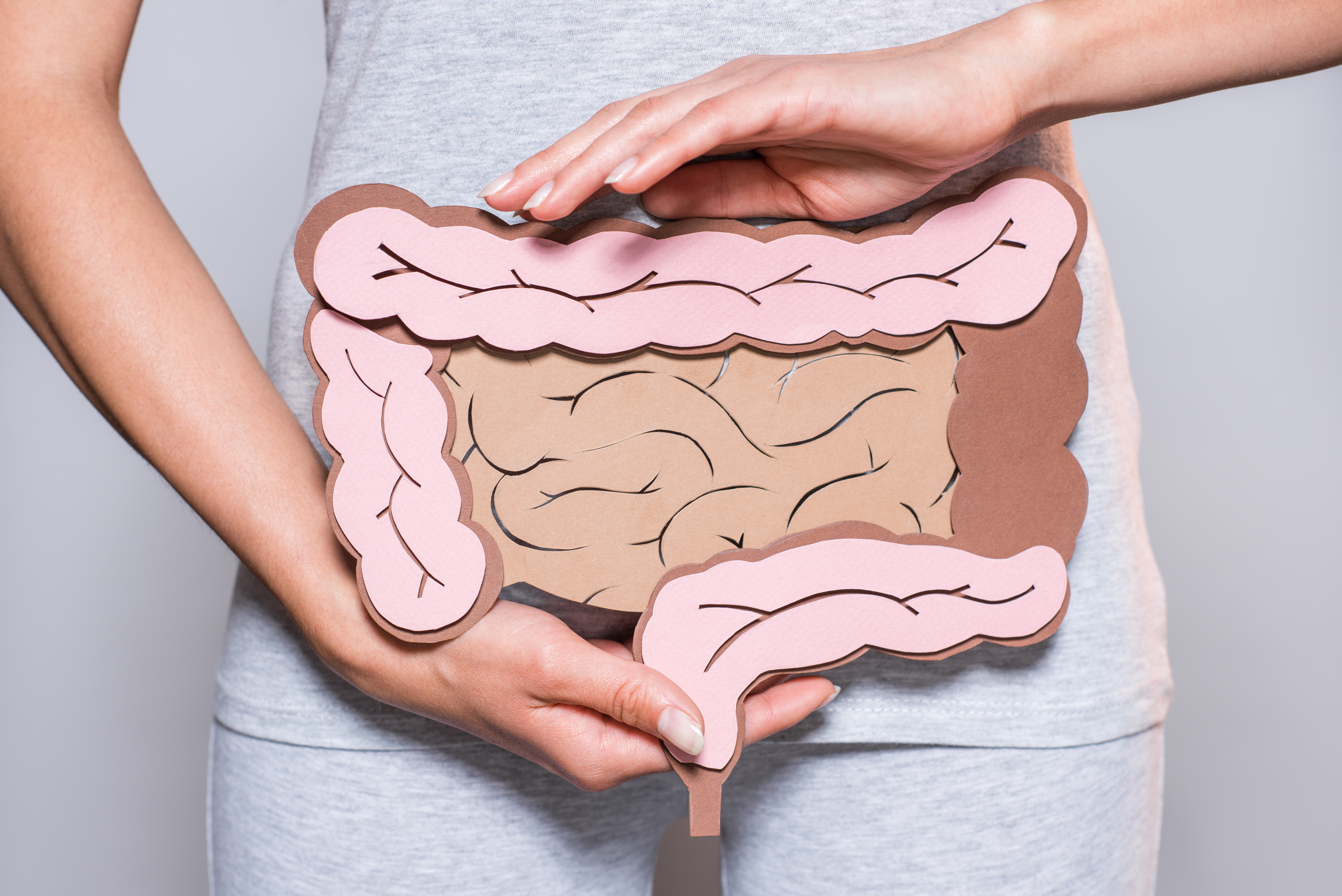Woman at home dealing with gut discomfort